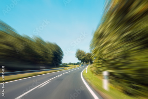  driving fast -  motion blur on rural highway