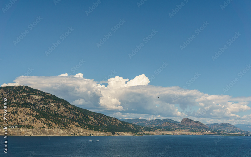 Okanagan lake at summer day with clouds on the sky. Okanagan lake at summer day with clouds on the sky.
