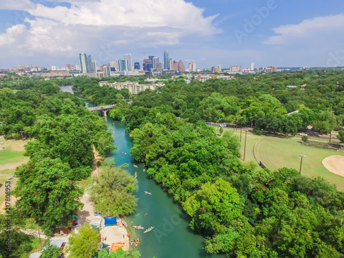 Aerial view Downtown from Barton Creek in Greenbelt at Zilker Metropolitan Park south Austin with summer blue cloud sky. Located at eastern edge of Hill Country, Austin the state capital of Texas, US. photo