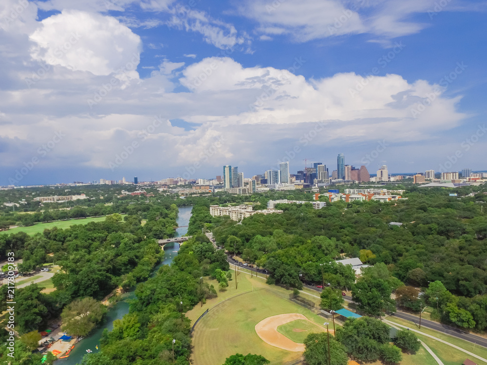 Aerial view Downtown from Barton Creek in Greenbelt at Zilker Metropolitan Park south Austin with summer blue cloud sky. Located at eastern edge of Hill Country, Austin the state capital of Texas, US.