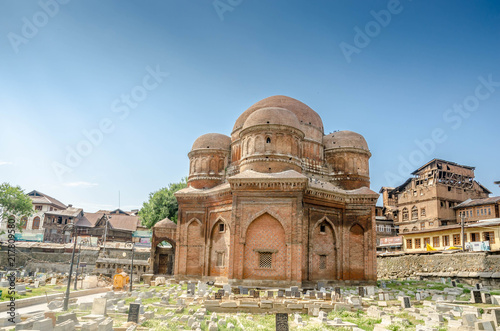 Srinagar, Jammu and Kashmir, India - July 4, 2017 : Graves surround the Tomb of Budshah, a popular tourist attraction in Srinagar, Kashmir, India.