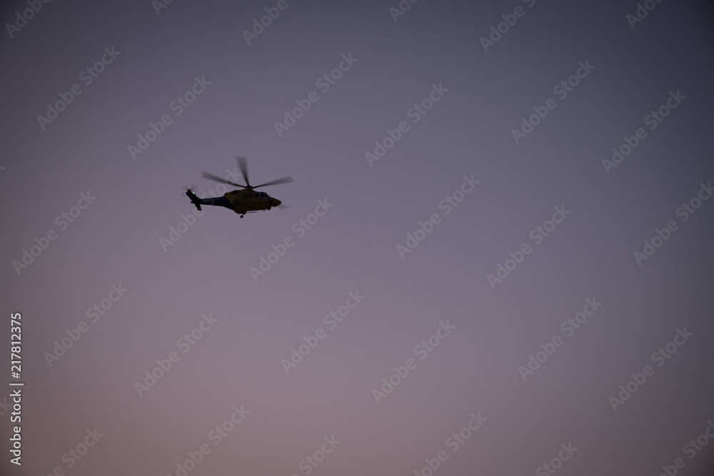 helicopter in the dusk sky helicopter in the dusk sky