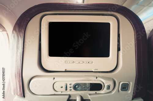 Close-Up of Touching Screen Multimedia Monitor for Entertainment on Air Flight, Airplane Facility Service for Passenger Seat. Monitor Control inside Passengers Cabin Aircraft