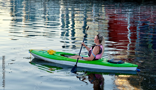 Quadro su tela Young woman kayaking paddling  in  the ocean