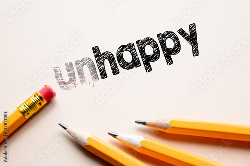 Making unhappy in to happy by eraser. Cencept for action and reaching goals