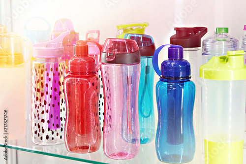 Sports colored plastic bottles for drinking water in shop
