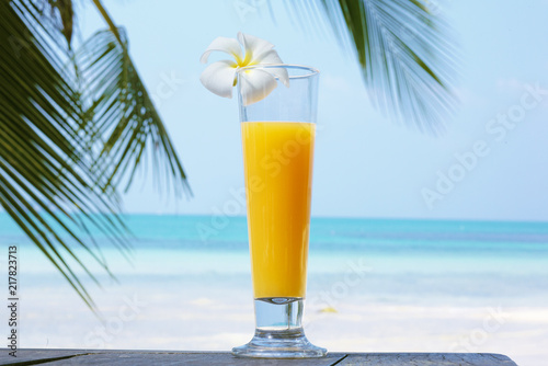 glass of juice with a view of the sea.