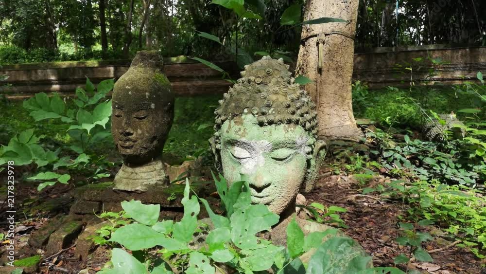 Buddha field of broken sculpture with beautiful ancient Buddha statue