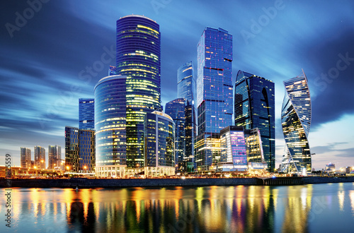 Moscow City skyline . Moscow International Business Centre at night time with Moskva river.