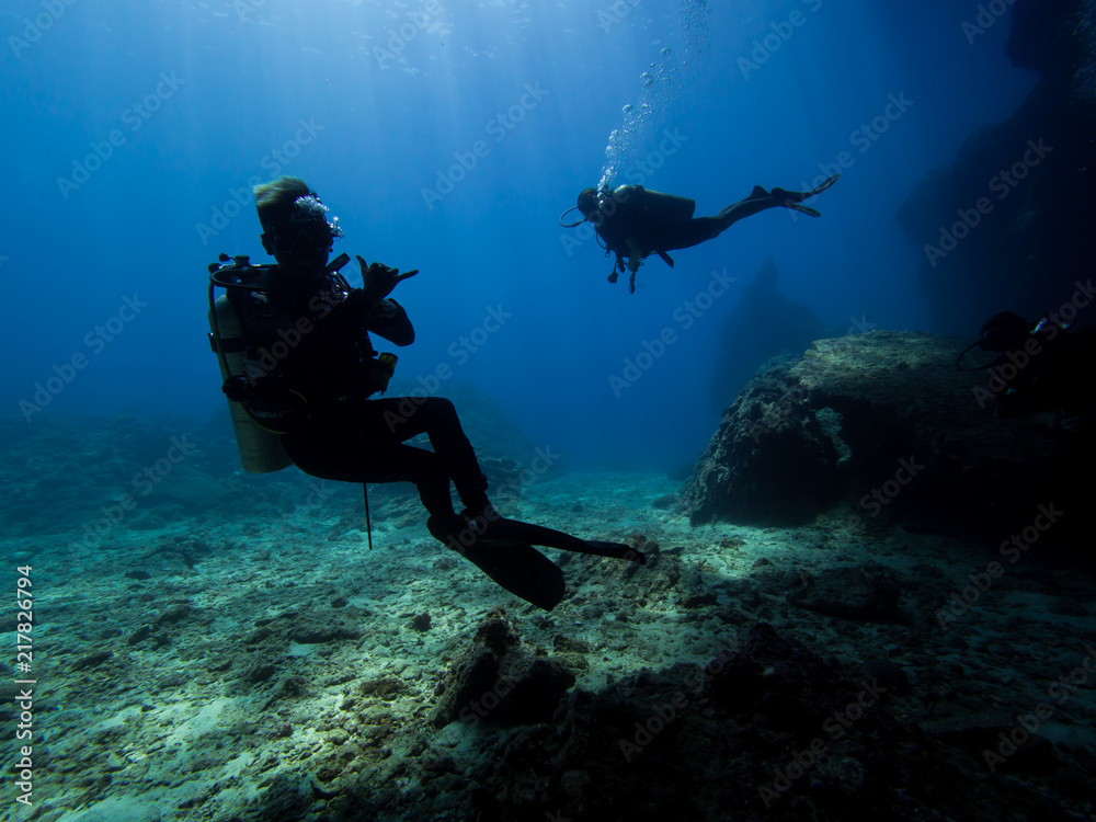 Two diver silhuettes Two diver silhuettes