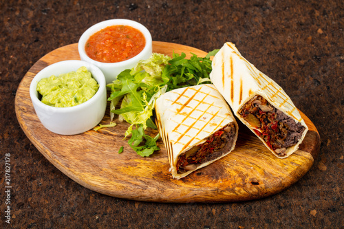 Delicious burito with sauce