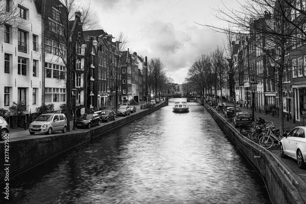 Black and white photo of a canal boat in the Brouwersgracht in the old center of Amsterdam