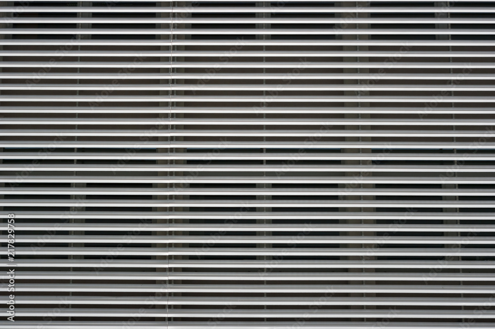 Modern architecture, detailed view of the window with pre-jaw blinds. Modern architecture, detailed view of the window with pre-jaw blinds.