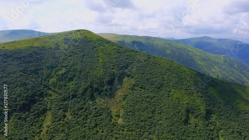 Aerial of a green mountain creast of a triangular form in the Carpathians in summer photo