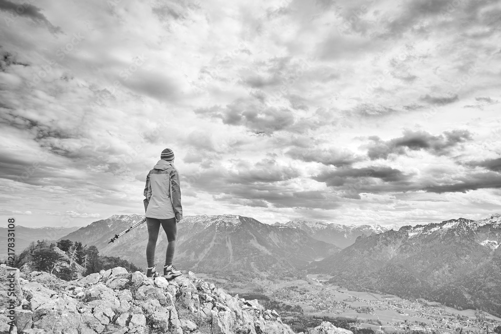 Woman on top of mountain