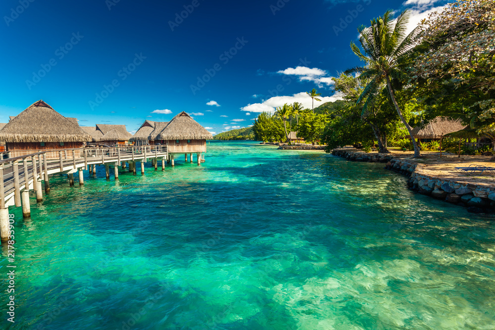 Over water bungalow with steps into amazing lagoon, Moorea - obrazy, fototapety, plakaty 