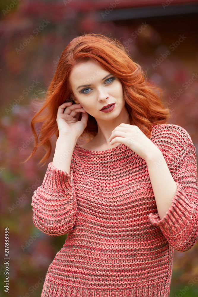 Naklejka premium Outdoor lifestyle photo of young beautiful lady. red hair . Warm autumn. Warm spring