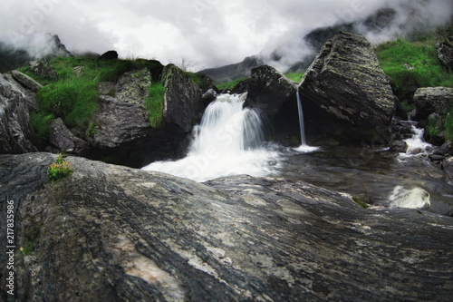 Beautiful mountain landscape in Transfagarasan. Romania. Waterfall.