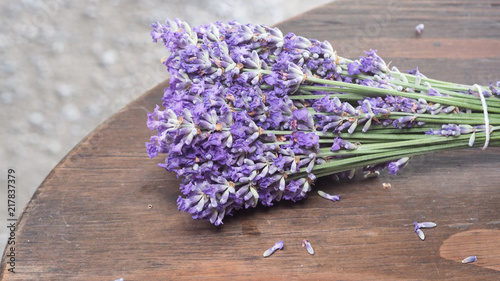 Lavender flower close up and blooming put on the wood table. It give relax herb smell.