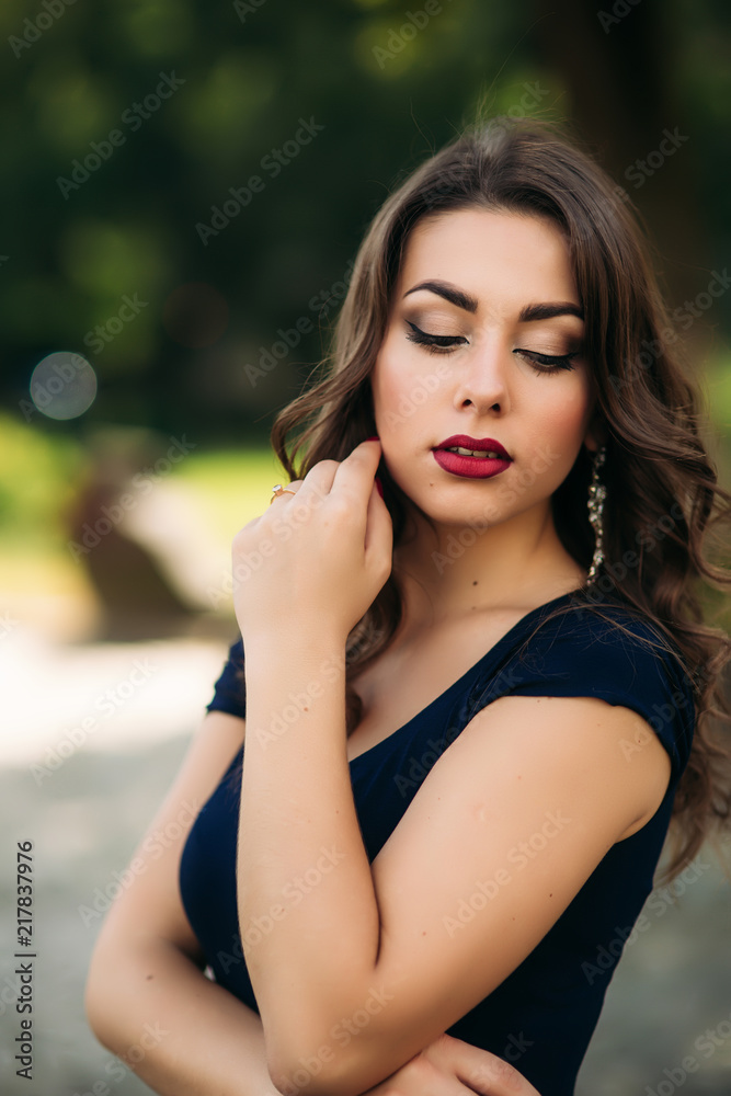 Fototapeta premium Portrait of beautiful girl with prifessional makeup and hair style