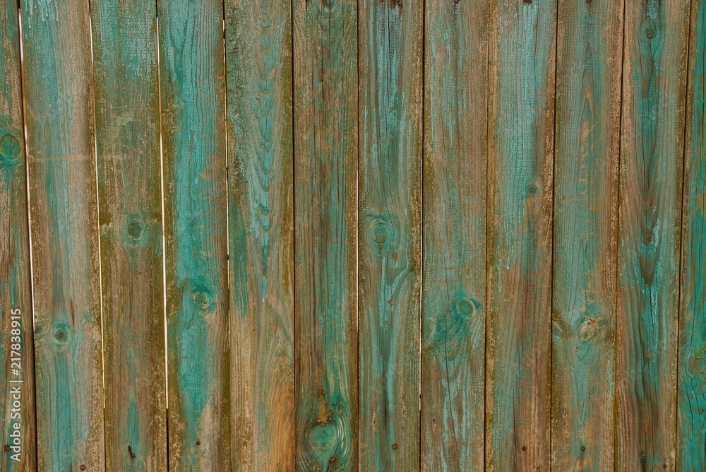green brown wooden texture of old boards in the wall of a fence green brown wooden texture of old boards in the wall of a fence