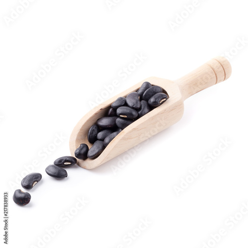 Black bean in a wooden bowl isolated on white background