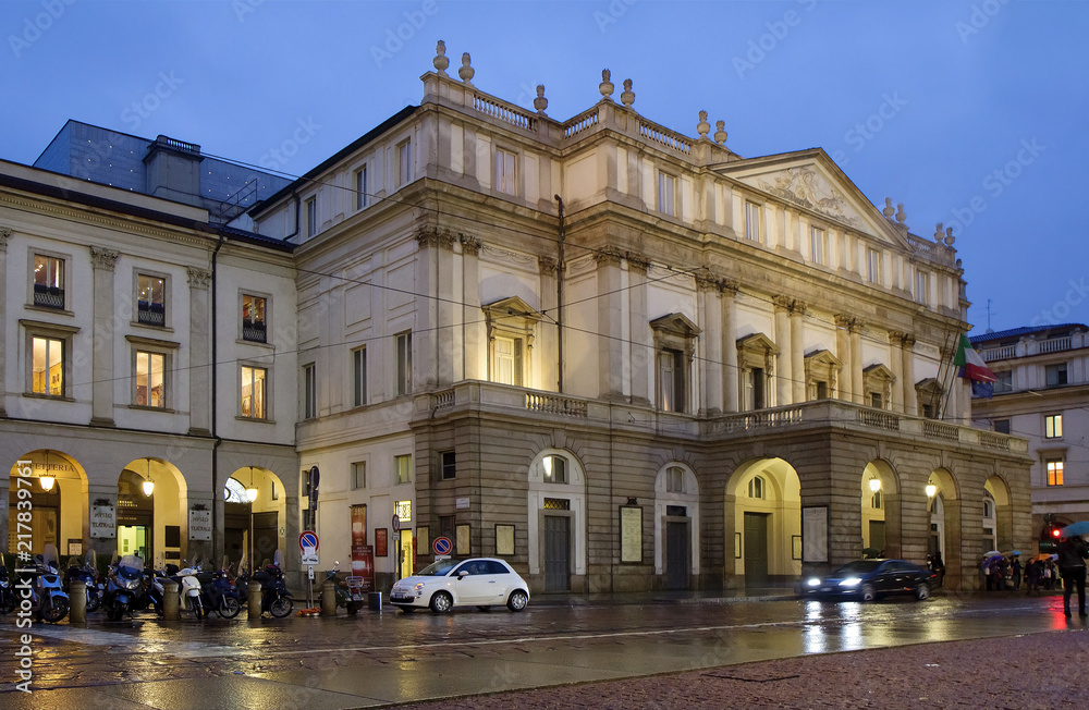 Milan, Italy, La Scala theater building in the evening. La Scala is an Opera house in the center of Milan. The theater building was built in 1776-1778. Milan, Italy, La Scala theater building in the evening. La Scala is an Opera house in the center of Milan. The theater building was built in 1776-1778.