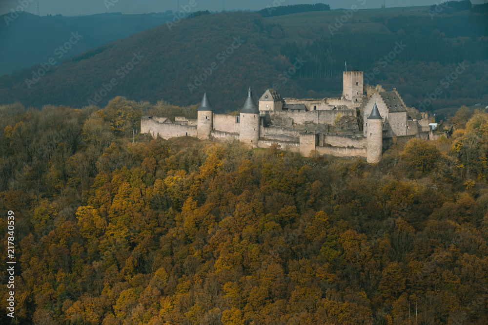 Bourscheid castle with autumn colors, cloudy day