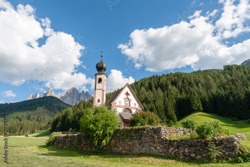 The Church of St. Johann in Ranui, in the Italian Dolomites, on a summer afternoon.