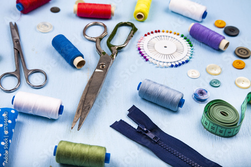 Sewing accessories on a blue background