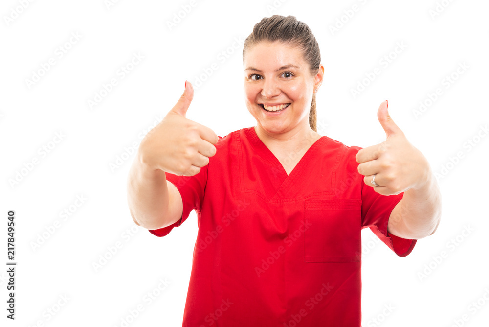 Medical nurse wearing red scrub showing double thumb up gesture. Medical nurse wearing red scrub showing double thumb up gesture.