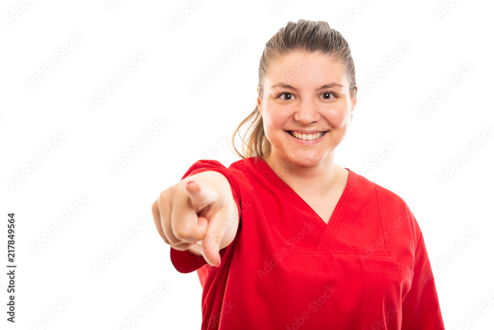 Young medical nurse wearing red scrub pointing finger to camera. Stock  Photo | Adobe Stock