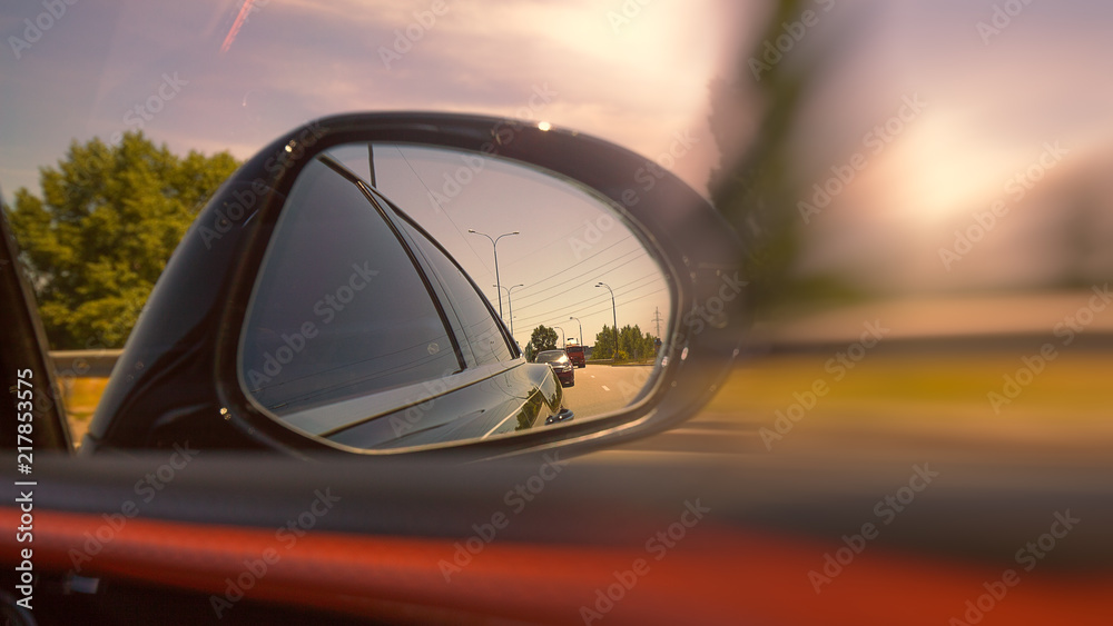 Looking through the mirror, street racers view, transportation backgrounds Looking through the mirror, street racers view, transportation backgrounds