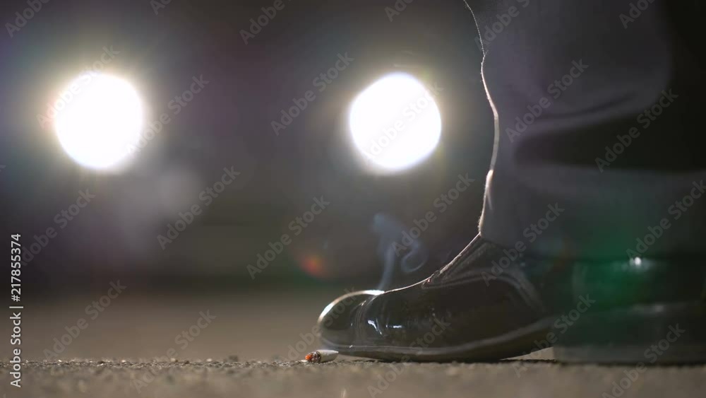 Man finishes cigarette and going to car, secret meeting at night, informant