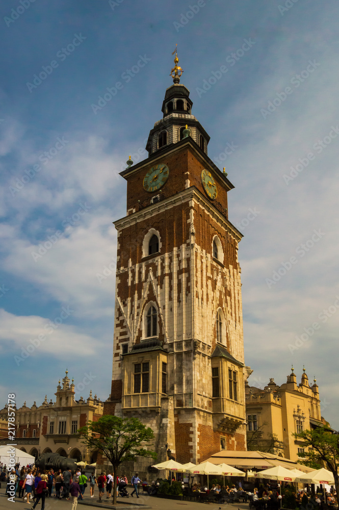 Town Hall Tower in Krakow, located in the Main Market Square in the Old Town district of the city. Sunny day with a lot of tourist enjoying the day.