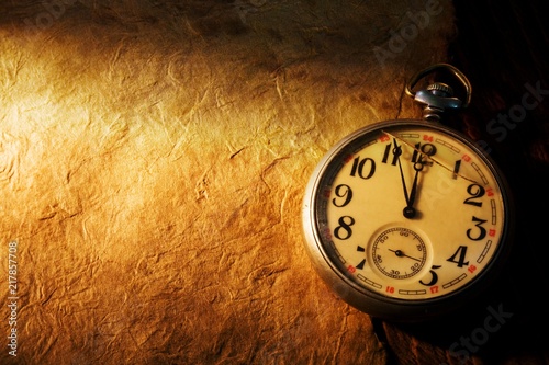 Close up view of the Pocket clock on old paper