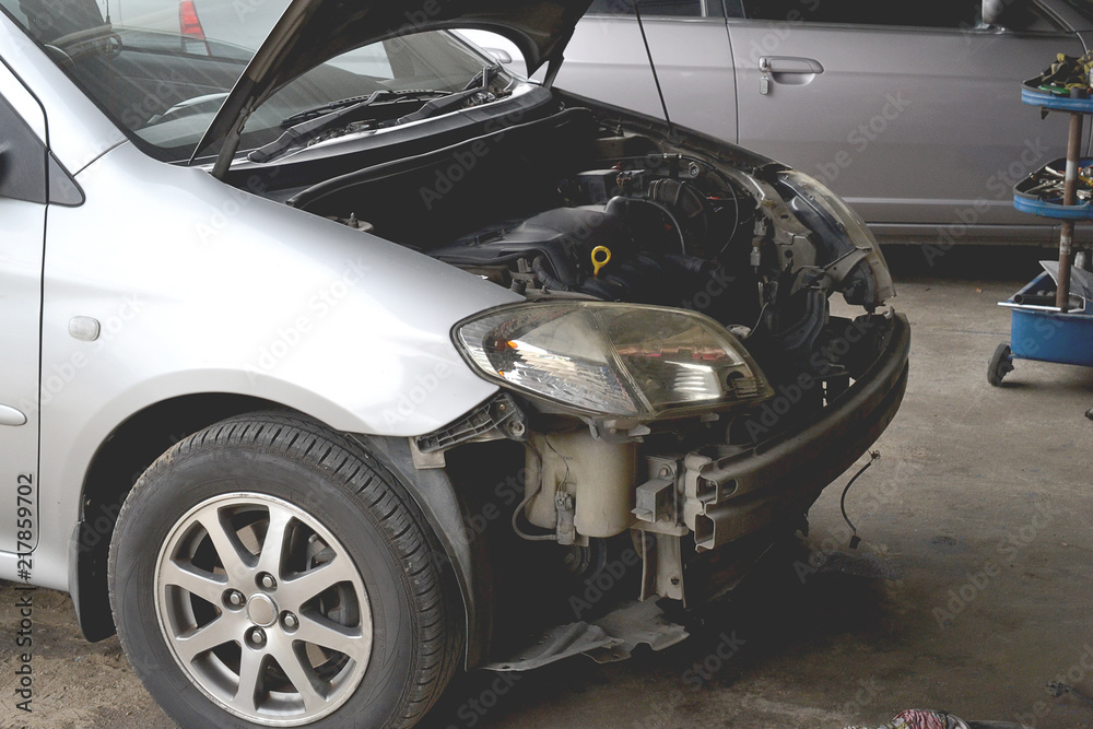 Broken car damage light and bumper accident wait to repair at car care