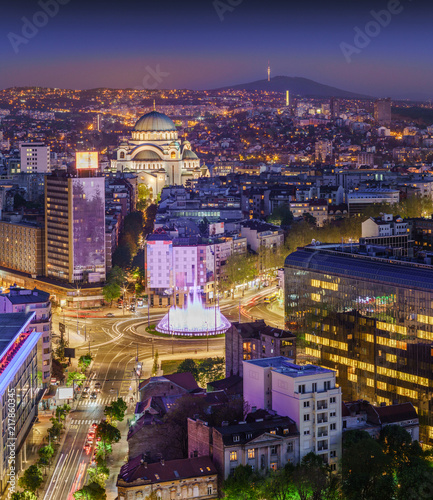 Aerial view of Belgrade Slavia Square, St Sava Temple, Avala Mountain by night panorama with city lights and fountain photo