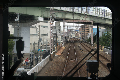  The train ride on the track of the railway corridor in Japan. Railway transport on the Osaka - Kobe route, Keihanshin, Japan. © milkovasa