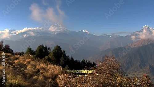 Poon hill mountains with a roadway to it in the center at day time
(TimeLapse) photo
