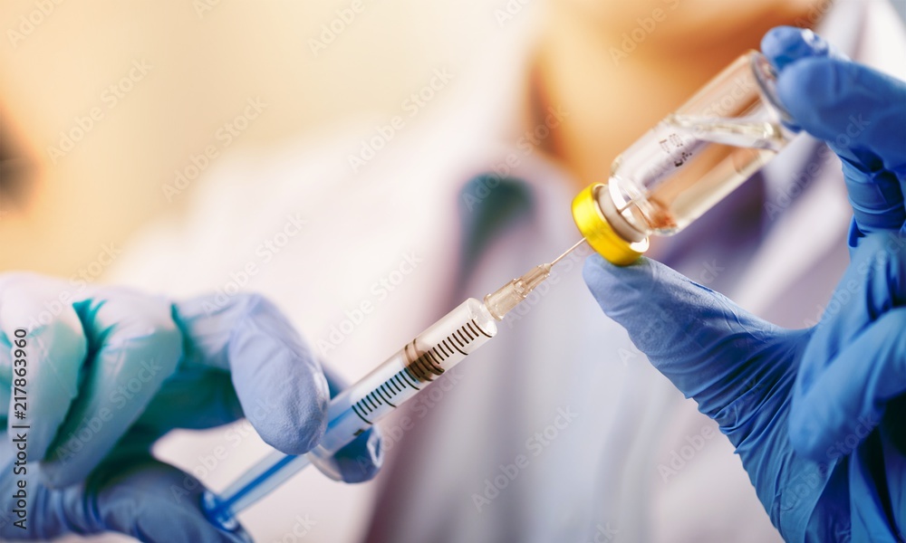 Human Hands with injection Syringe and medicine Human Hands with injection Syringe and medicine