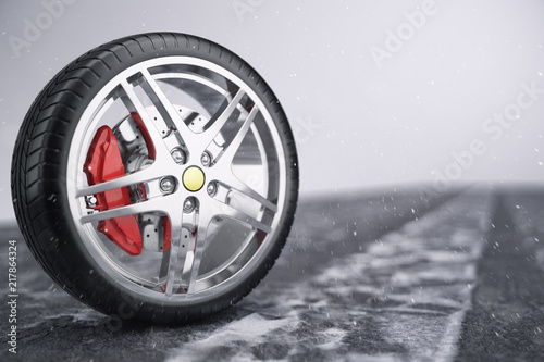 Car wheel, car tire standing on a road. Concept winter tyres. Winter tires with snowy background. Car tire with a disc standing on the road. 3D illustration