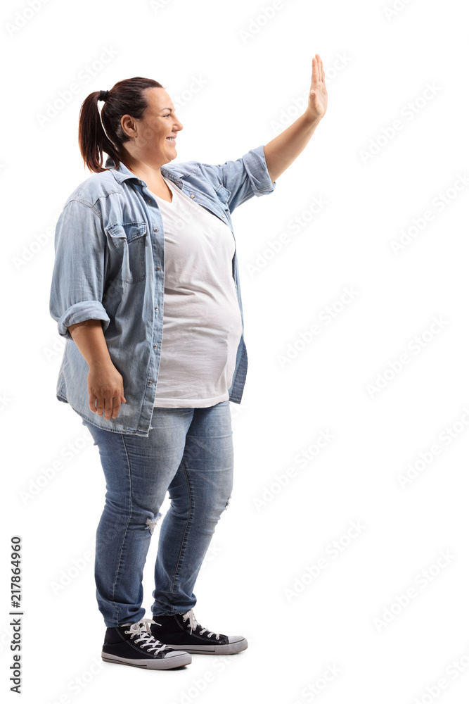 Fototapeta premium Young woman making a high-five gesture