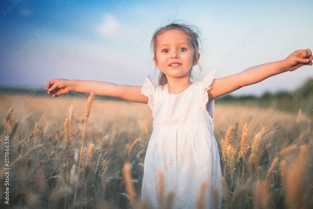 Happy Little Girl Imagine That She Flies At Wheat Field. Happy Little Girl Imagine That She Flies At Wheat Field.