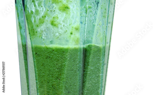 Green smoothie. Smoothie in blender with white background.