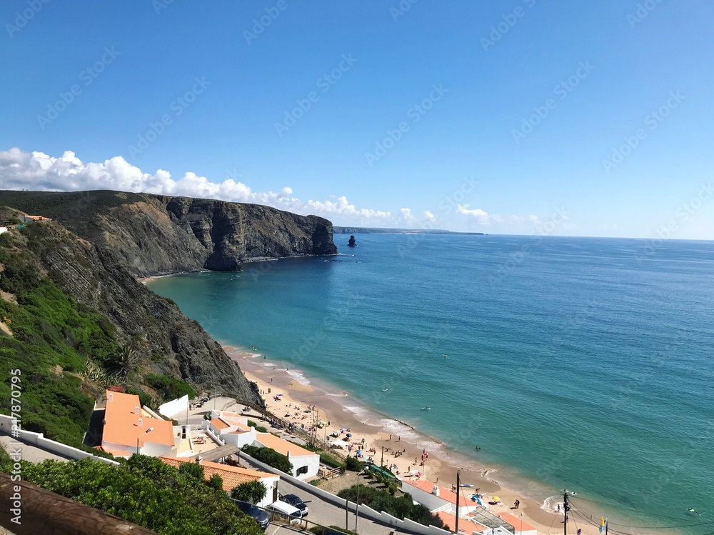 Panoramic view of the Atlantic ocean, algarve coast and blue flag sand beach. Arrifana beach in the Portugal, Algarve. Atlantic ocean coast and famous surfing area. Wallpaper, background.