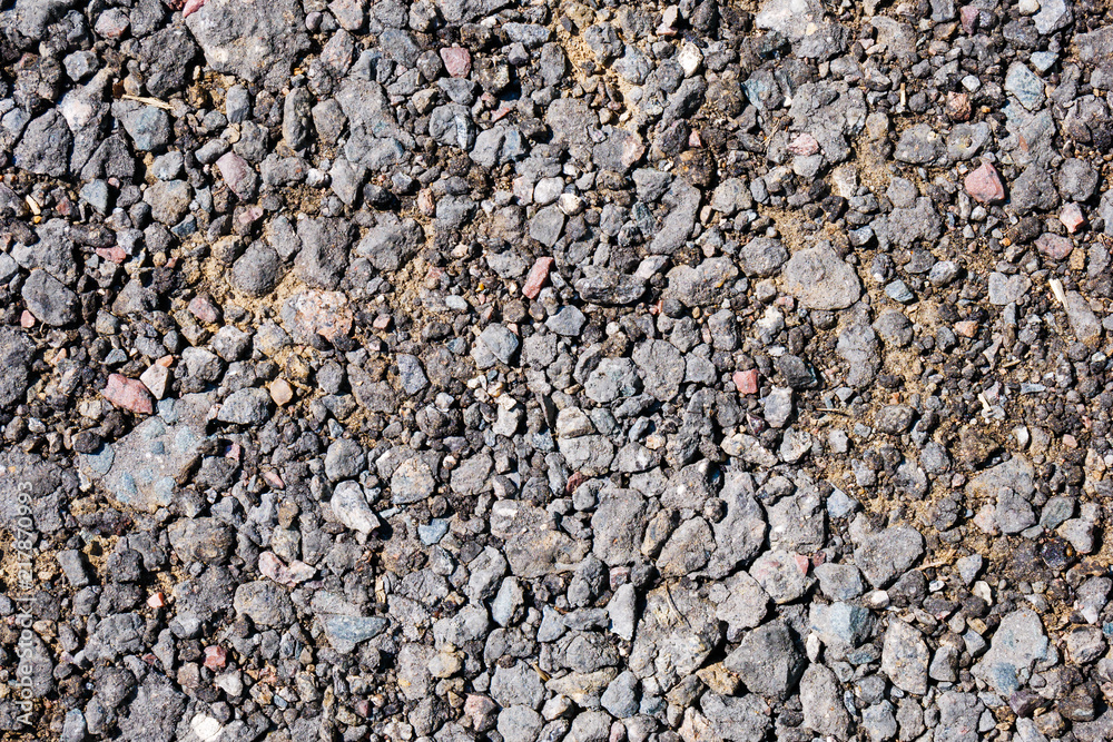 Crushed ballast gravel stone on ground. For texture and background Crushed ballast gravel stone on ground. For texture and background