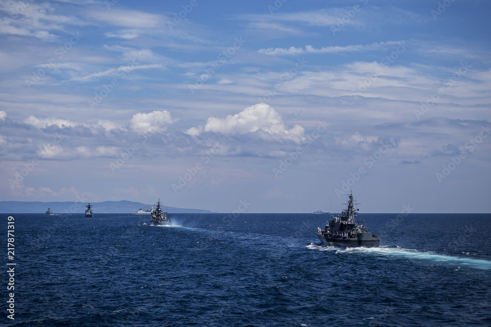 Group of ships during training in the Black Sea/Bulgaria/07.19.2018/ Military ships on water Editorial use only. A parade of warships against the background of a beautiful sky.