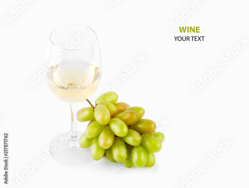 A glass of white wine with a bunch of green grapes on a white background. Alcoholic beverages.