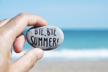 man on the beach and text bye, bye summer